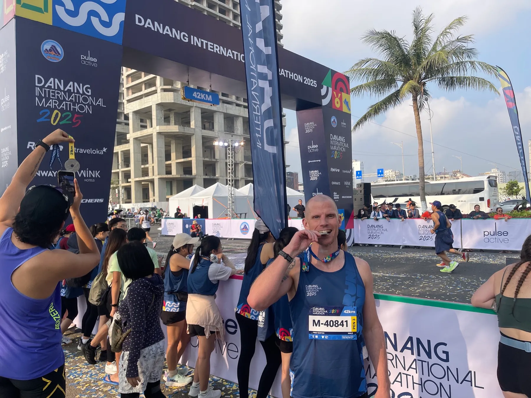 Ed with a race medal at the 2025 Da Nang International Marathon